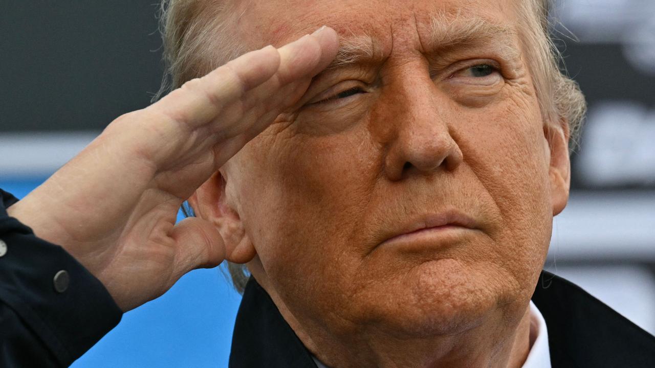 He’s saluting other Americans here, to be clear. Picture: Roberto Schmidt/AFP