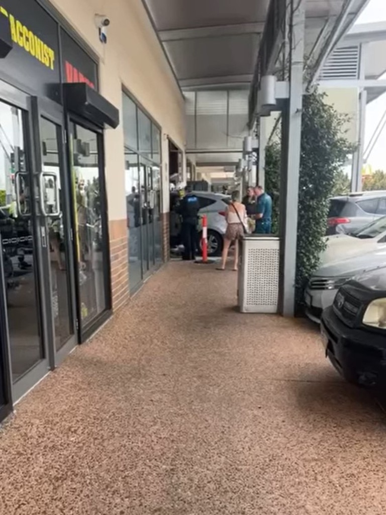 Paramedics and police on scene after a car smashed into Noodle Box in Pacific Pines. Photo: Facebook/Koby Drain