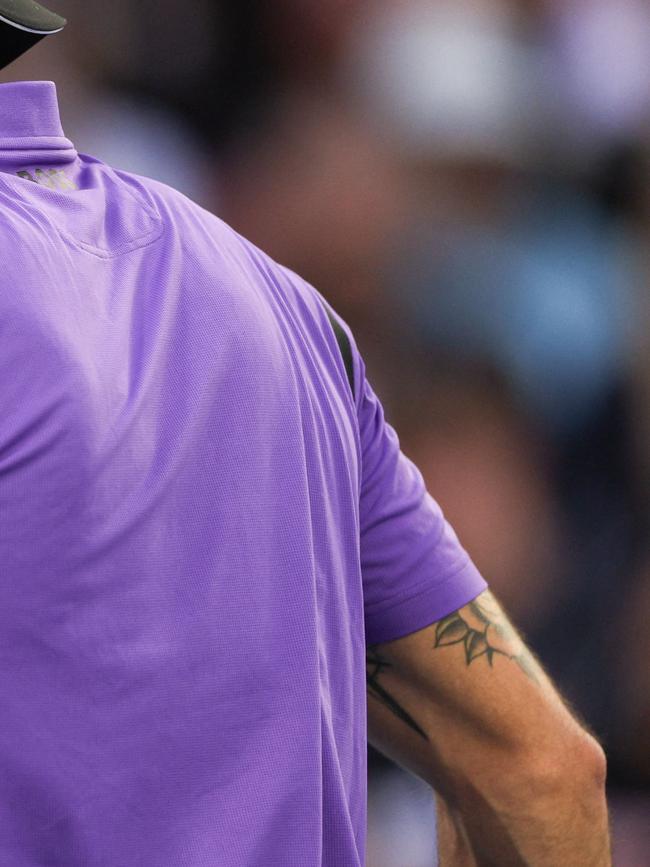 Berrettini’s tattoos can be seen on his arm. Picture: Adrian DENNIS / AFP