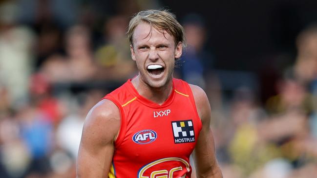 GOLD COAST, AUSTRALIA - MARCH 09: Jack Lukosius of the Suns celebrates a goal during the 2024 AFL Opening Round match between the Gold Coast SUNS and the Richmond Tigers at People First Stadium on March 09, 2024 in Gold Coast, Australia. (Photo by Russell Freeman/AFL Photos via Getty Images)