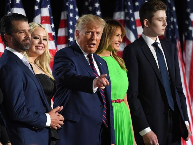 (R-L) Barron Trump, US First Lady Melania Trump, US President Donald Trump, Tiffany Trump and Donald Trump Jr. stand onstage at the conclusion of the final day of the Republican National Convention from the South Lawn of the White House on August 27, 2020 in Washington, DC. (Photo by SAUL LOEB / AFP)