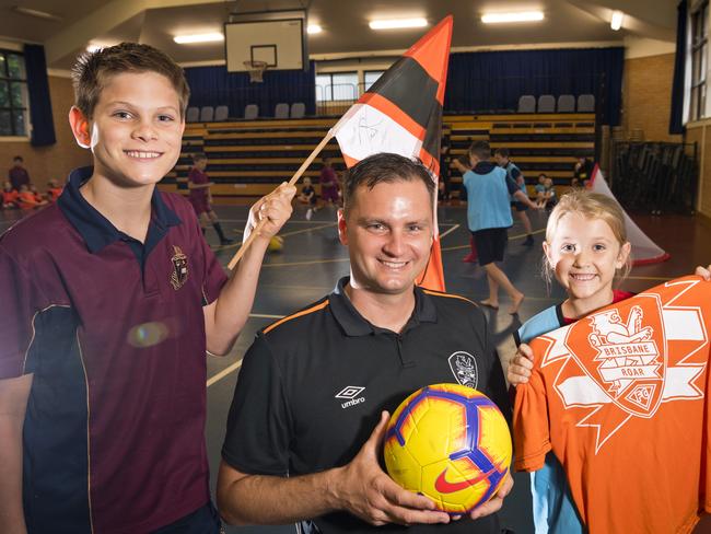 Toowoomba Anglican School students Hayden Johnston and Olivia McNicol talk football with Brisbane Roar Academy general manager Warren Moon, Monday, March 9, 2020. Picture: Kevin Farmer