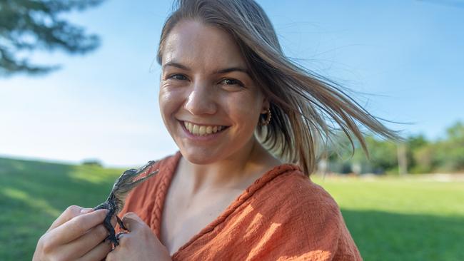 Anita Price is the owner of Schnappy the croc. She has trained the little one to walk on a lead and can often be seen letting it go for a walk or swim at Casuarina Beach, Darwin. Picture: Che Chorley