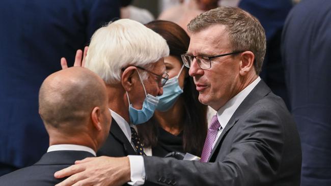 Alan Tudge MP, congratulates Treasurer Josh Frydenberg on delivering the budget in the House of Representatives at Parliament House. Picture: Getty