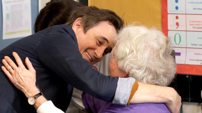 Dalton hugs his former English teacher Shirley Adams, 90, during a visit to his old Bracken Ridge State High School. Picture: Steve Pohlner