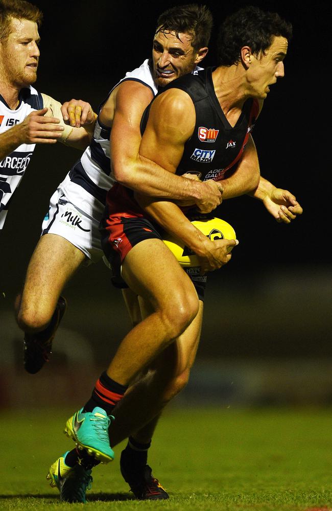 South Adelaide’s Jackson McMahon tackles West Adelaide’s Tom Keough.