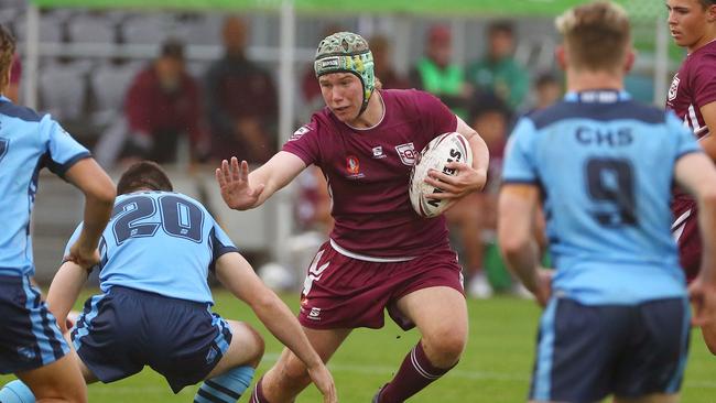 Action from the Australian state schools national rugby league championship match between Queensland Maroon and NSW CHS. Diesel Taylor attacks. Picture: Tertius Pickard