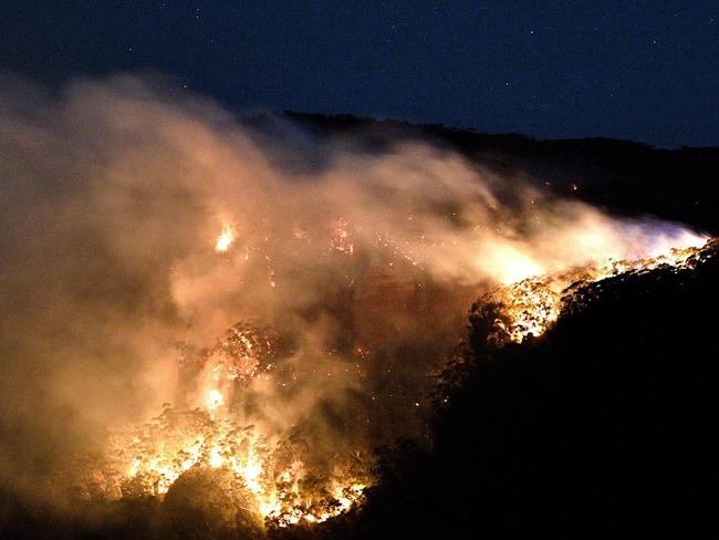 A bushfire burns out of control in the Blue Mountains on Monday. Picture: Saeed Khan/AFP