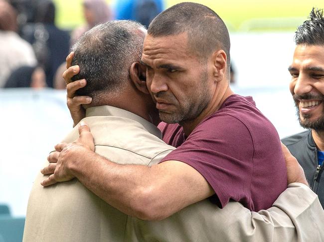 Australian boxer Anthony Mundine (centre) joins Muslims for the call to pray at Hagley Park,. Picture: AAP Image/SNPA, Martin Hunter