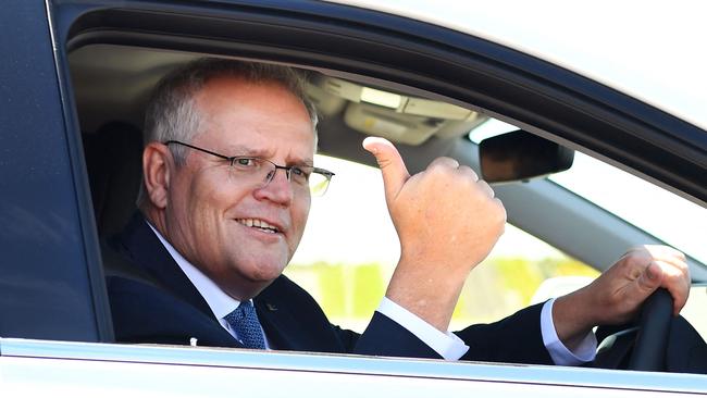 Scott Morrison drives a hydrogen-powered car around a test track in Melbourne after launching the government’s Future Fuels strategy. Picture: AFP