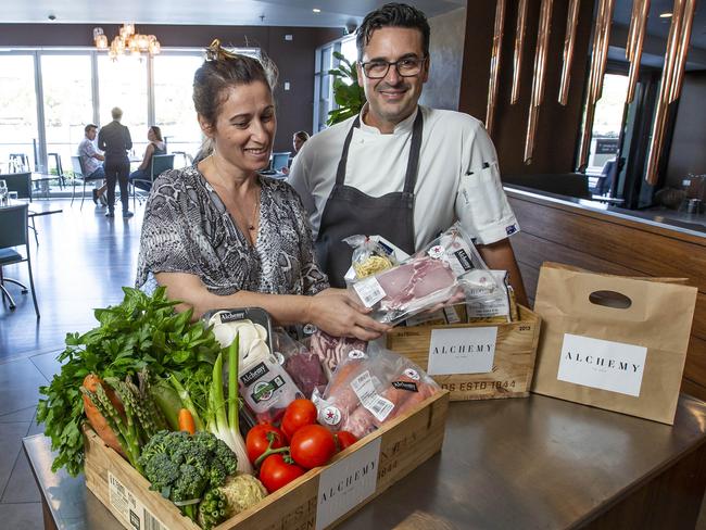 Angelica Jolly and husband Brad at Alchemy restaurant with fresh produce. Picture: Mark Cranitch.