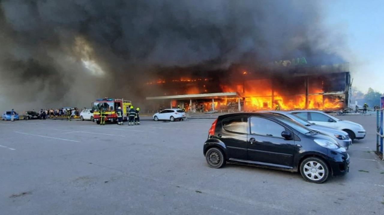 Firefighters putting out a blaze in the shopping centre hit by a Russian missile strike in the eastern Ukrainian city of Kremenchuk. Picture: AFP