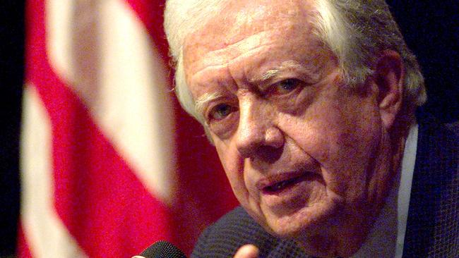 (FILES) Former US president Jimmy Carter gestures while addressing a press conference April 1, 1999 during his visit to the Indonesian capital. Carter, the 100-year-old former US president and Nobel peace laureate who rose from humble beginnings in rural Georgia to lead the nation from 1977 to 1981, has died, his nonprofit foundation said on December 29, 2024. (Photo by Emmanuel DUNAND / AFP)
