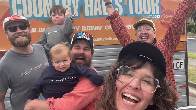 Fanny Lumsden with her husband Dan Stanley Freeman (right with glasses), their children Walter (toddler) and Rupert (baby) and Prawn Stars bandmates. Picture: Supplied.