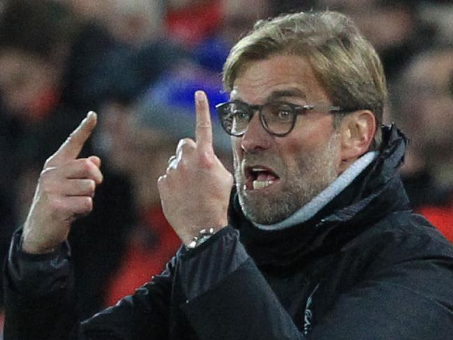 Liverpool's German manager Jurgen Klopp gestures from the touchline during the English Premier League football match between Liverpool and West Ham United at Anfield in Liverpool, north west England on December 11, 2016. / AFP PHOTO / Lindsey PARNABY / RESTRICTED TO EDITORIAL USE. No use with unauthorized audio, video, data, fixture lists, club/league logos or 'live' services. Online in-match use limited to 75 images, no video emulation. No use in betting, games or single club/league/player publications. /