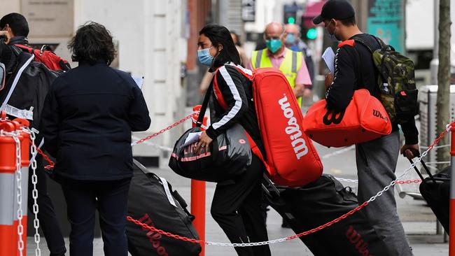 Tennis players and officials arriving at the Grand Hyatt hotel for a two-week quarantine period ahead of the Australian Open tennis tournament. Picture: William West/AFP