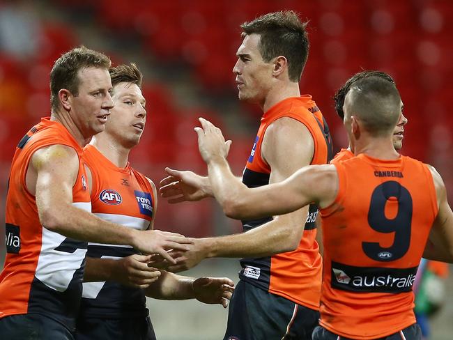 Toby Greene celebrates with team mates after kicking a goal during the round two AFL match between the Greater Western Sydney Giants and the Gold Coast Suns on April 1.