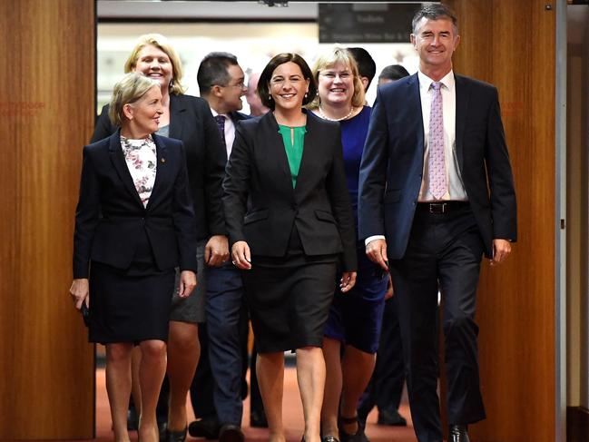 Queensland LNP leadership contender Deb Fracklington (centre), flanked by fellow party members Ros Bates (left) and Tim Mander, arrives at a party room meting at Parliament House in Brisbane, Tuesday, December 12, 2017. The LNP party room is meeting to choose a new leader after their recent state election loss. (AAP Image/Dan Peled) NO ARCHIVING