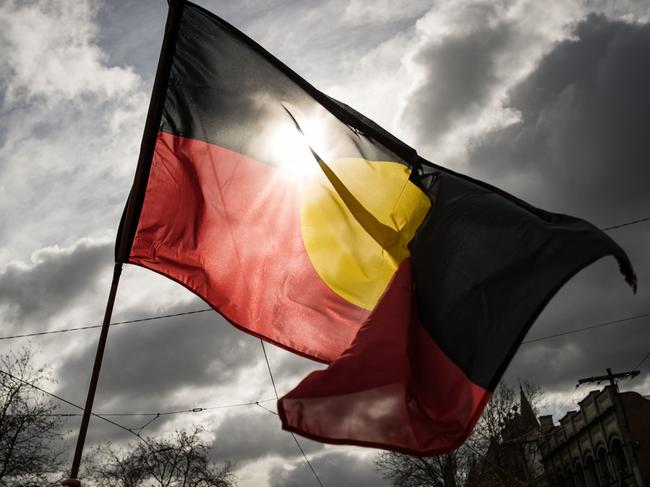 MELBOURNE, AUSTRALIA - JULY 07: The Aboriginal flag is seen flying during the NAIDOC March on July 07, 2023 in Melbourne, Australia. NAIDOC Week is an Australian observance lasting from the first Sunday in July until the following Sunday. The acronym NAIDOC stands for National Aborigines and Islanders Day Observance Committee. The week is intended as a time when all Australians can reflect on the rich history of the country's indigenous peoples, and learn about the cultures and histories of first nations groups. (Photo by Darrian Traynor/Getty Images)