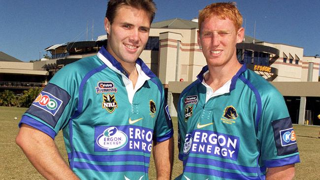 Dane Carlaw and Brad Meyers model the teal strip in 2002. Picture: Bruce Long