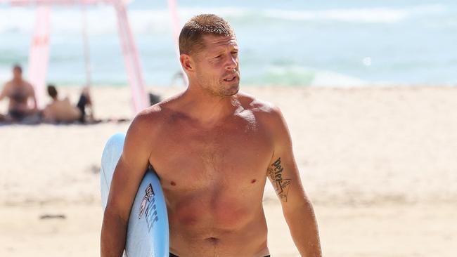 Hundreds of people turned out at the Greenmount Beach Surf Club on the Gold Coast in March, to celebrate the life of Ed Fanning. Brother Mick led a surf out after the service. Picture: NCA NewsWire/Tertius Pickard.