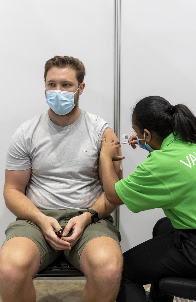 Rhys Barnes gets a Pfizer vaccination at the Brisbane Convention and Exhibition centre vaccination hub. NewsWire / Sarah Marshall