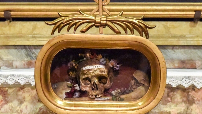 <h2>1. A famous cranium</h2><p>I find it simultaneously gruesome and beautiful. Before me, inside Rome’s 6<sup>th</sup> century Basilica di Santa Maria in Cosmedin, is a cracked and discoloured human skull embellished by colourful flowers and encased in a golden reliquary. While its presentation is elegant, far more casual is the painted white label on its forehead which reads: “S. Valentini M.”.</p><p>Surprisingly, that’s the only indicator I can see here that these are the remains of Valentine, perhaps the world’s most famous Saint. Every year on February 14, couples from Sydney to Stockholm celebrate their love on Valentine’s Day, an ancient festival with cloudy origins.</p><p>Similarly uncertain is whether the skull I’m staring at actually belonged to St Valentine, an Italian holy man who died more than 1,700 years ago. Because across Europe there’s a dozen churches which claim to possess a physical remnant of Valentine. Historians say ancient relic traders tricked many such churches into believing they were buying the teeth, bones or clothes of famous saints. Whether it is the real deal or not, this skull is eerily interesting.</p>