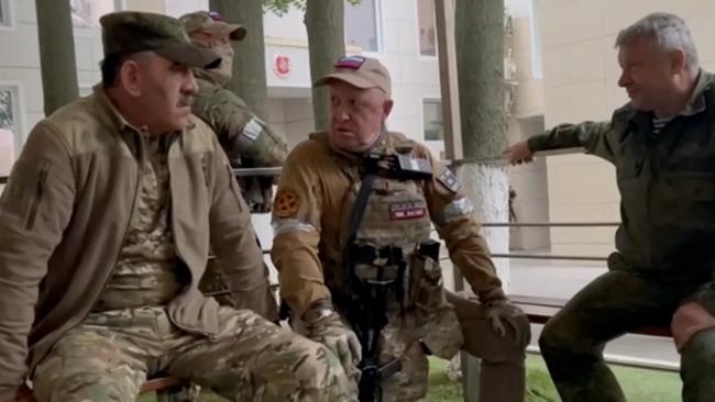 Yevgeny Prigozhin (C) speaking with Lieutenant General Vladimir Alekseev (R) and Russian Defense Deputy Minister Yunus-Bek Evkurov (L) in Rostov-on-Don. Picture: AFP.