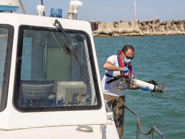 Sea water is tested off Fiumicino, near Rome. Picture: AP