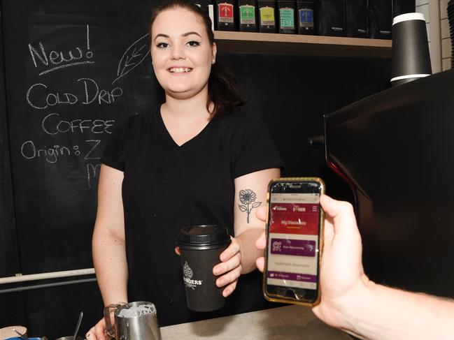 Ben’s Bakehouse barista Breanna Inch accepts a customer’s MyDarwin voucher. Darwin restaurant's and cafes have been the big winners from the MyDarwin voucher scheme, with the final $75,000 spent in just 24 hours. Picture: Katrina Bridgeford