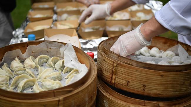 Chefs steamed thousands of dumplings for the world record of 764 eating yum cha at one time. Picture: AAP Image/ Joel Carrett