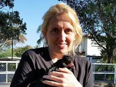 Catherine Kelaher of Hen Rescue NSW with one of the chickens which were dumped in Campsie on Wednesday.