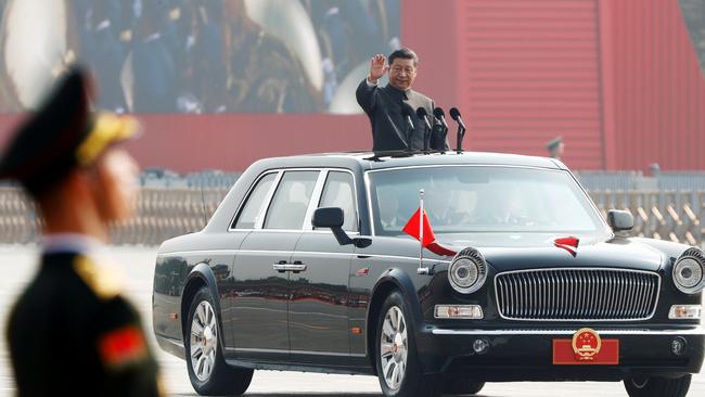 Chinese President Xi Jinping waves from a vehicle as he reviews the troops at a military parade in Beijing. Picture: Reuters