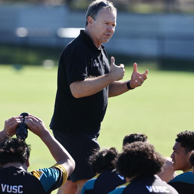 Vic Uni coach Tony Adams makes a point to his players.