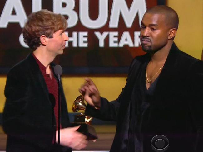 Kanye West storms the stage as Beck beats Beyoncé to win Album of the Year at the Grammy Awards.