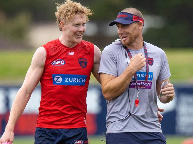 MELBOURNE, FEBRUARY 9, 2022: Melbourne Football Club coach Simon Goodwin pictured with Clayton Oliver during MFC training at Casey Fields. Picture: Mark Stewart