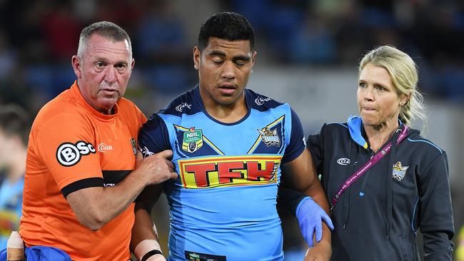 Moeaki Fotuaika comes off the ground after being concussed. Picture: AAP Image/Dave Hunt