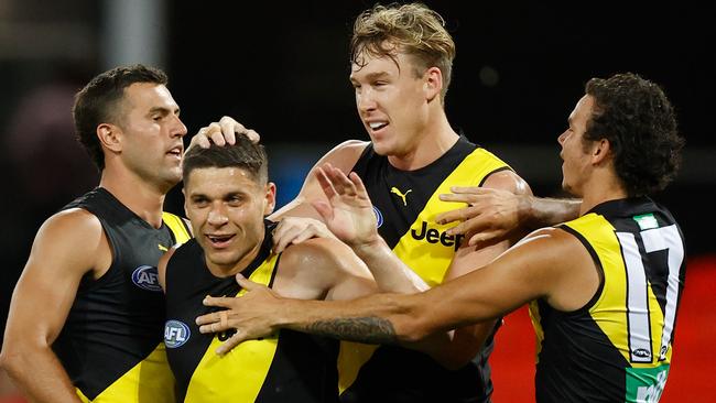 Jack Graham, Dion Prestia, Tom Lynch and Daniel Rioli celebrate a Tigers goal.