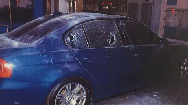 The BMW was sprayed with gunfire yet, miraculously, nobody inside was killed