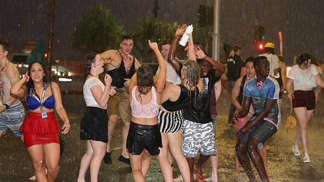 School leavers party hard as a storm hits on Caville Ave on Saturday night in Surfers Paradise. Pic: Lindsay Moller