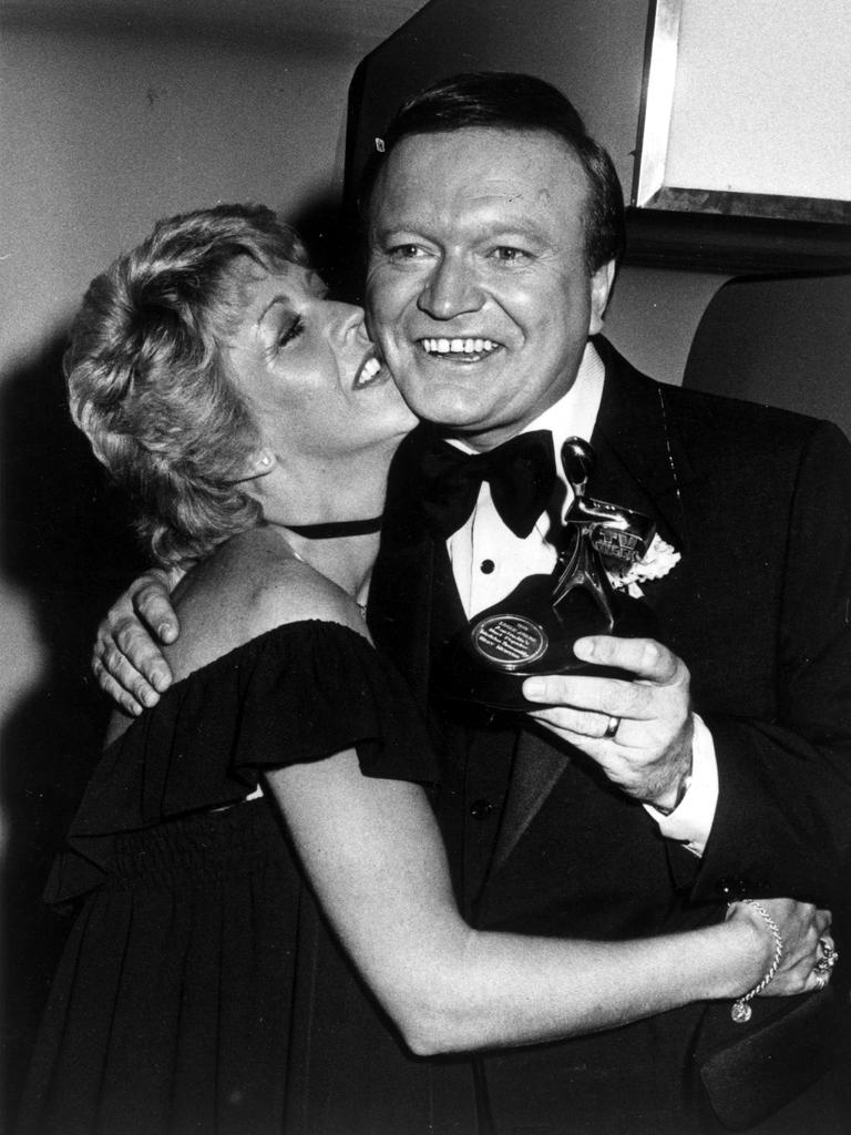 Newton gets a kiss from wife Patti after winning the Gold Logie.