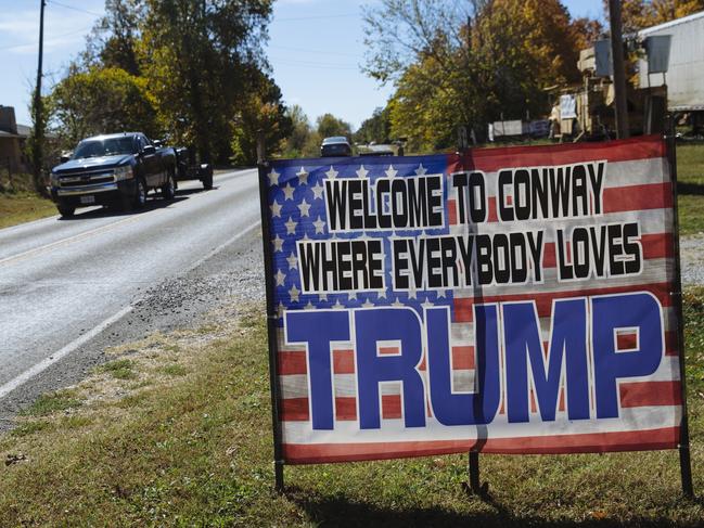 A homemade sign reading "Welcome to Conway, Where everybody loves Trump" is seen alongside Route 66 in Conway, Missouri, USA. Picture: Angus Mordant for News Corp Australia