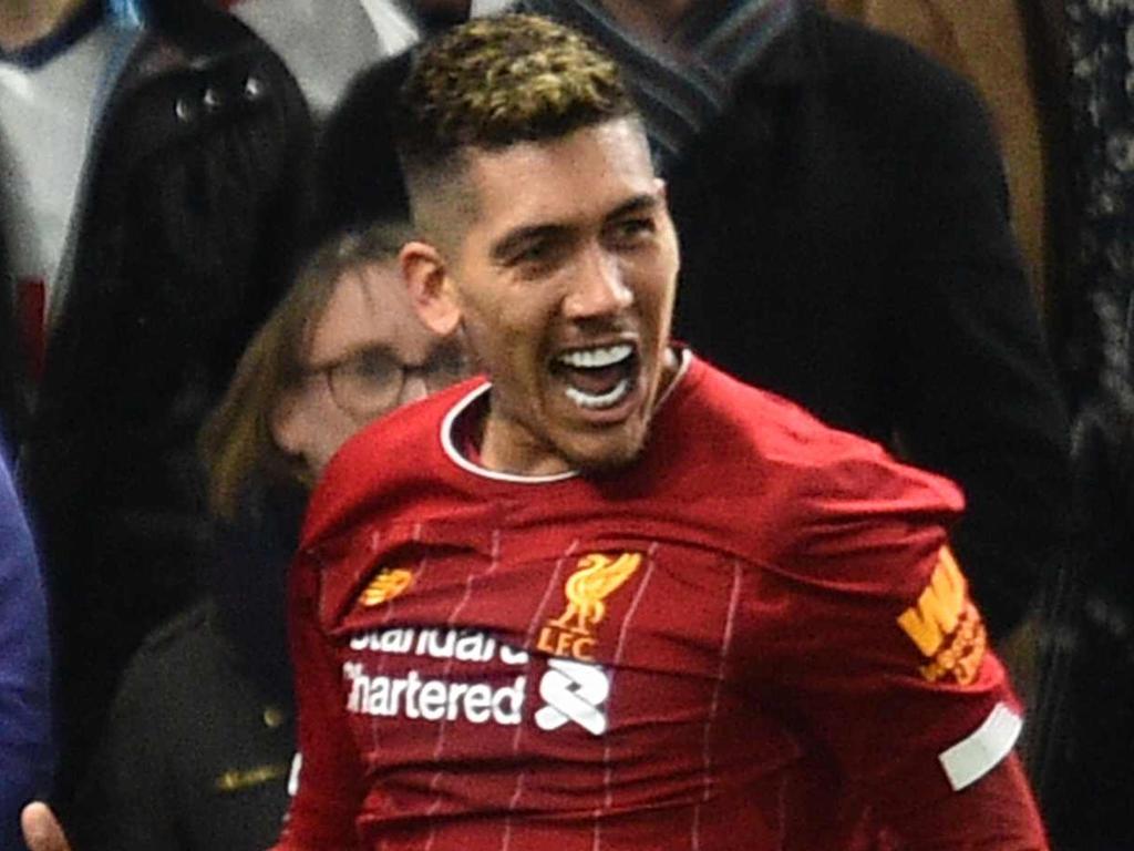 Liverpool's Brazilian midfielder Roberto Firmino (L) celebrates scoring the opening goal during the English Premier League football match between Tottenham Hotspur and Liverpool at Tottenham Hotspur Stadium in London, on January 11, 2020. (Photo by Glyn KIRK / AFP) / RESTRICTED TO EDITORIAL USE. No use with unauthorized audio, video, data, fixture lists, club/league logos or 'live' services. Online in-match use limited to 120 images. An additional 40 images may be used in extra time. No video emulation. Social media in-match use limited to 120 images. An additional 40 images may be used in extra time. No use in betting publications, games or single club/league/player publications. /