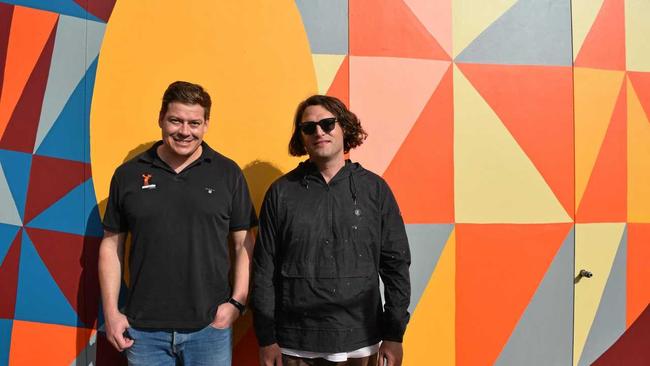 TARGO STREET ART: Orange Moose Dentistry owner Hanno Venter and artist Kyle Hughes-Odgers, enjoying the special and "almost finished" wall mural, ahead of the practice opening later this month. Picture: Rhylea Millar