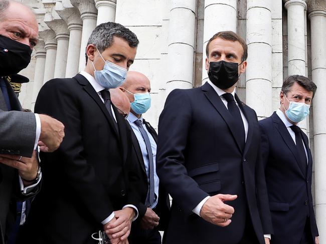 French Justice Minister Eric Dupond-Moretti, left, French Interior Minister Gerald Darmanin, French President Emmanuel Macron and Nice Mayor Christian Estrosi visit the murder scene in Nice. Picture: AFP