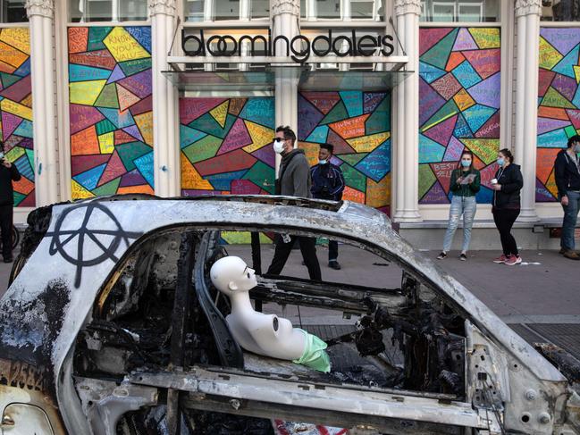 A mannequin sits in a burnt police vehicle in the Soho neighbourhood of Manhattan in New York City. Picture: AFP