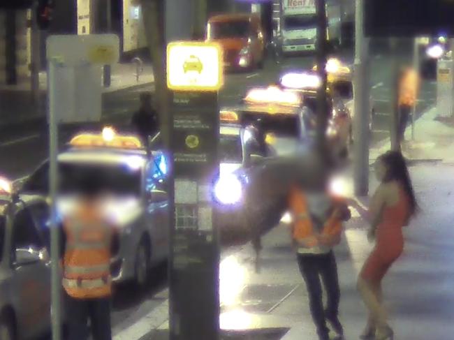 A woman appears to tussle with a security guard. Picture: NSW Police