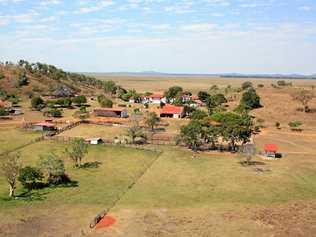 HOME SWEET HOM: An aerial view of the homestead at Toorilla Plains which runs 2,500 head of cattle. LEFT: Craig and Latisha Mace with their two children Will and Mekensi in their younger days . Picture: Toorilla Plains