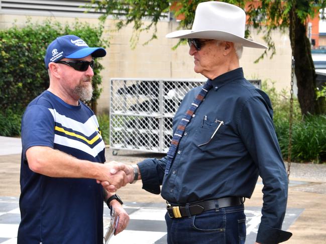 Bob Katter greets a voter outside the pre-polling centre in Ingham. Picture: Evan Morgan