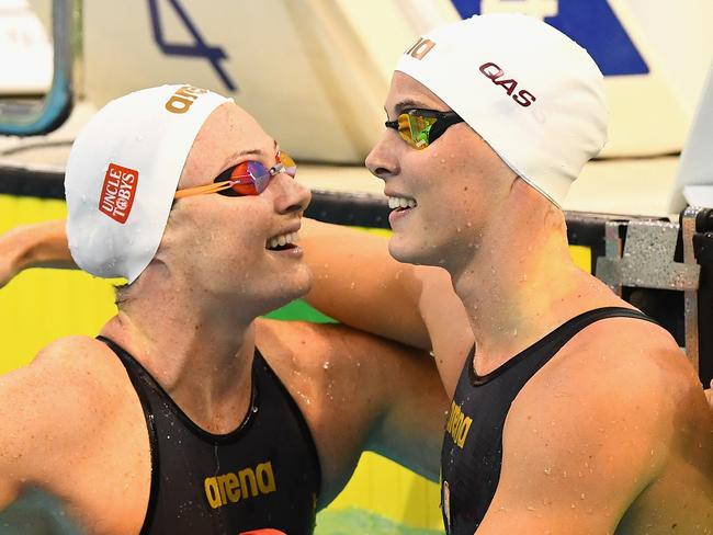 Cate Campbell (left) and sister Bronte hug after finishing first and second in the 100m freestyle at the Olympic swimming trials in Adelaide.